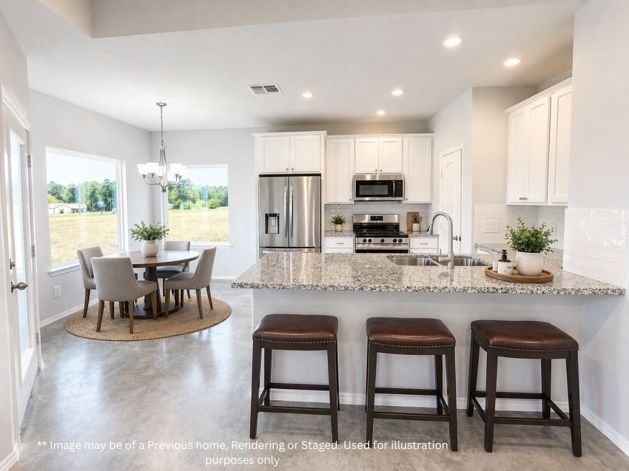 6 Greenway Drive Trinity, TX 75862 - Photo 8 of 27 a kitchen with kitchen island granite countertop a dining table chairs cabinets and stainless steel appliances