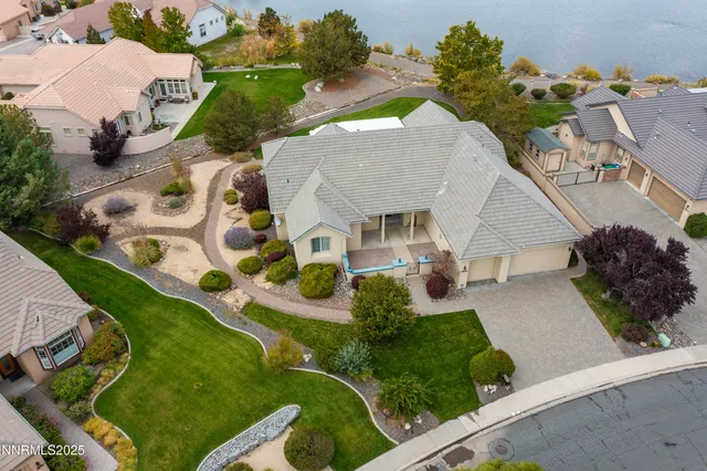a view of a room that has a bed and a table in it