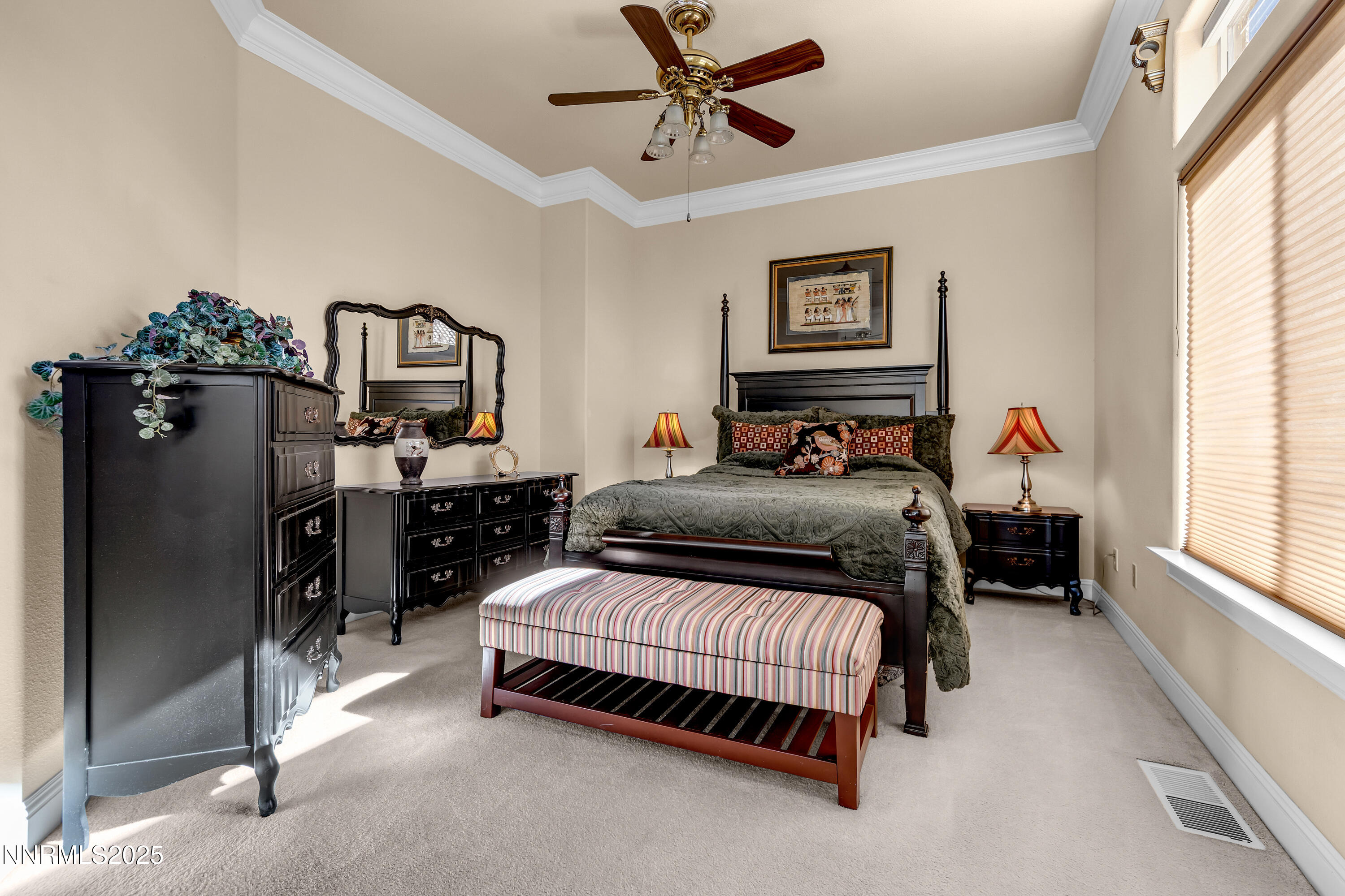 1860 Hidden Meadows Drive Reno, NV 89502 - Photo 15 of 34 a bedroom with a bed and a chandelier