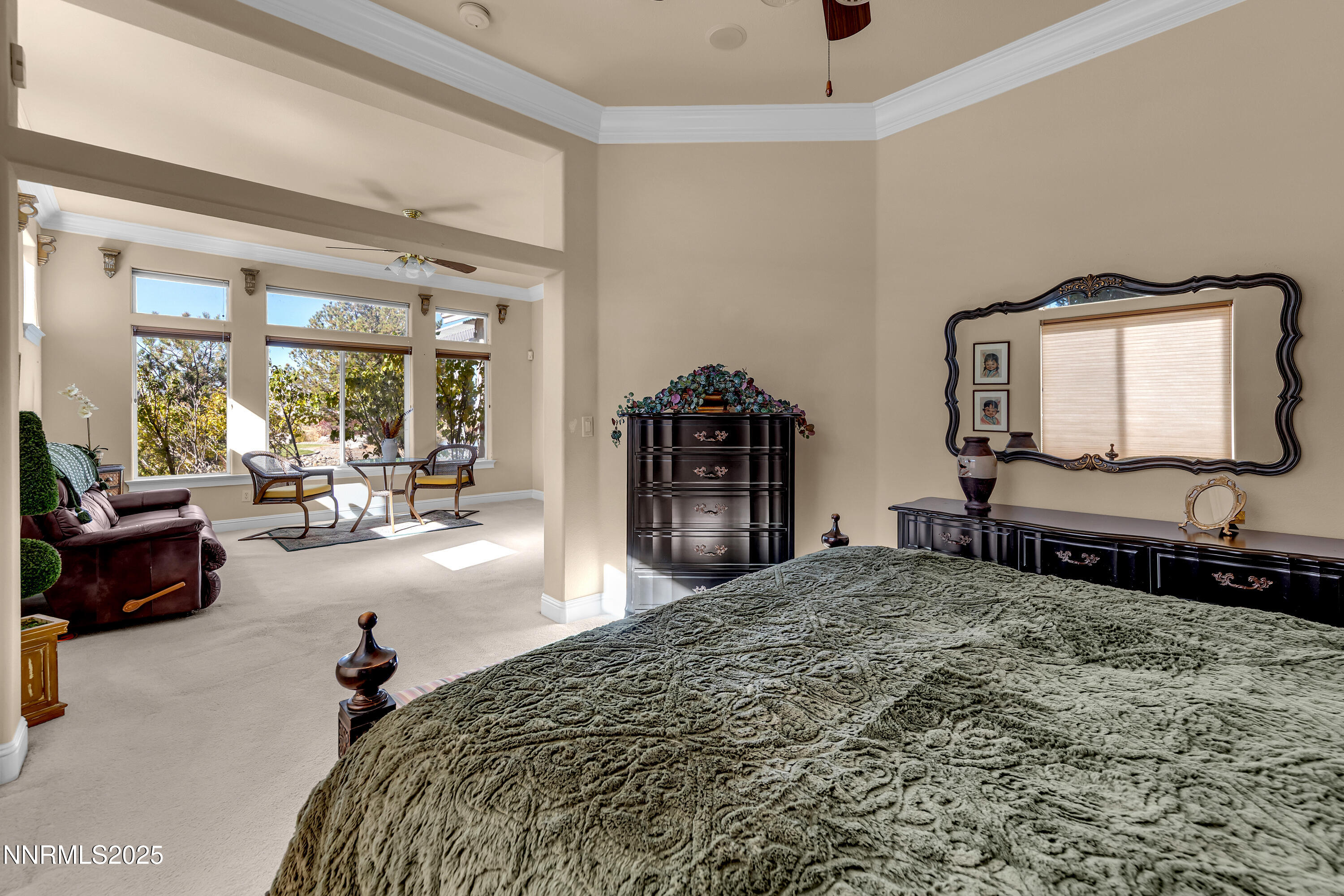 1860 Hidden Meadows Drive Reno, NV 89502 - Photo 17 of 34 a bedroom with a bed a couch and dresser