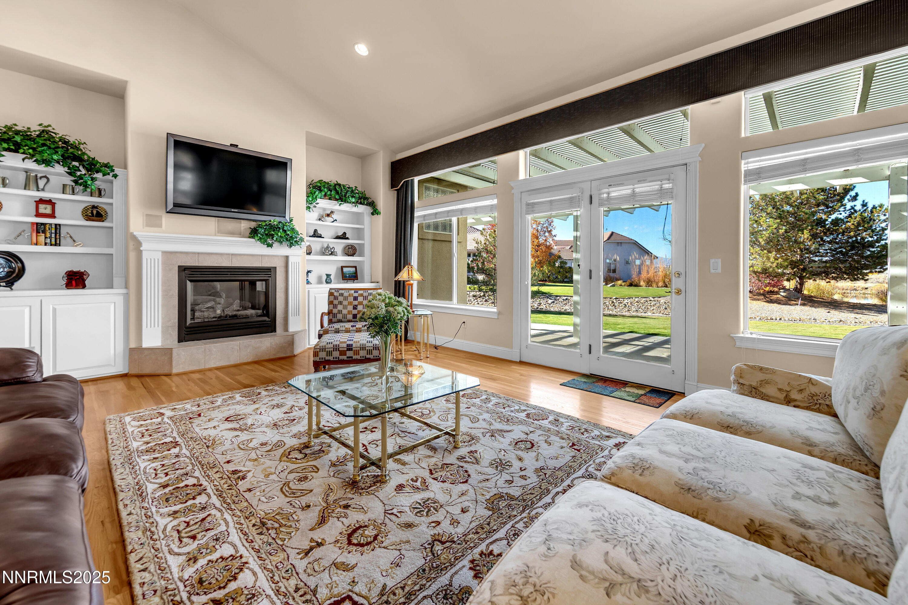 1860 Hidden Meadows Drive Reno, NV 89502 - Photo 27 of 34 a living room with furniture a flat screen tv and a fireplace