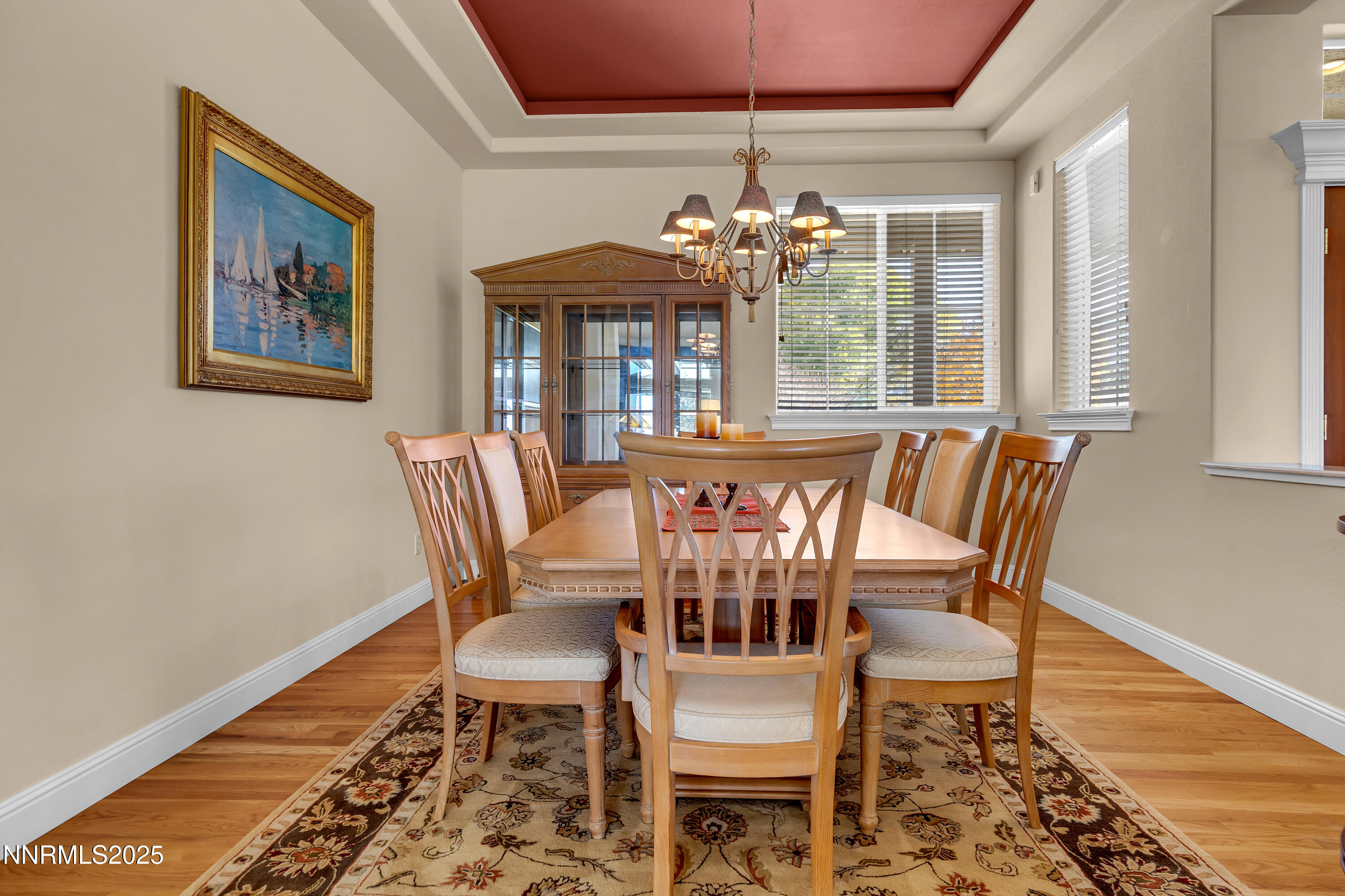 1860 Hidden Meadows Drive Reno, NV 89502 - Photo 30 of 34 a view of a dining room with furniture wooden floor and chandelier