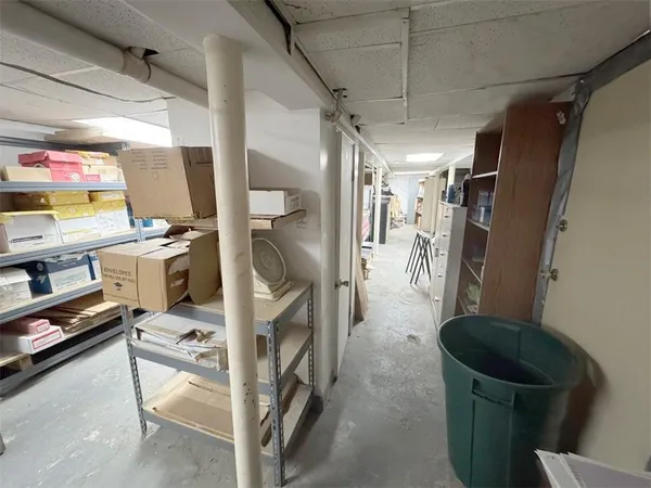 a bathroom with a granite countertop sink a mirror and a bathtub