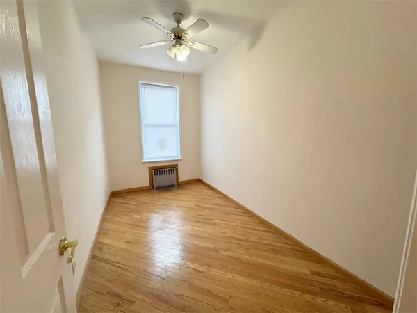 a room with gym equipment and a view of living room