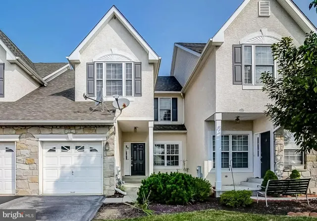 front view of a house and a yard