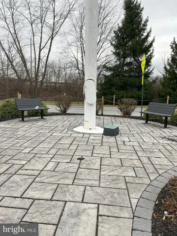 a view of a pathway with a yard