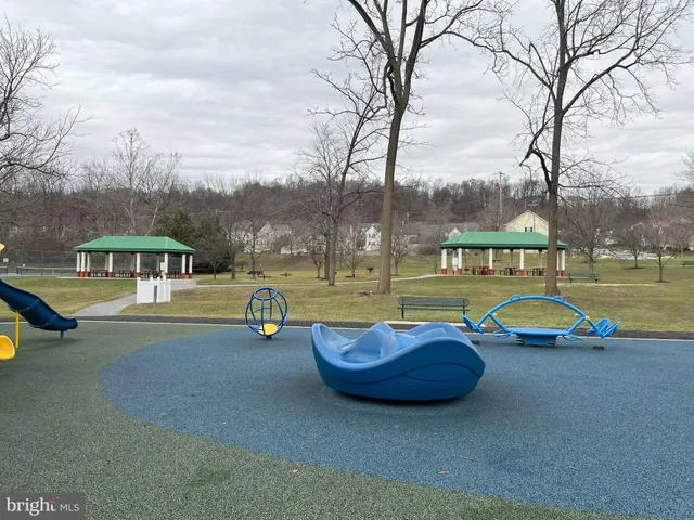 an aerial view of a house with swimming pool and deck