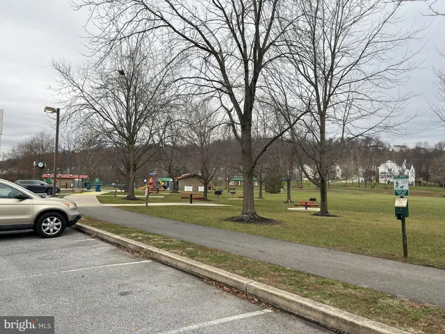 a view of street with parked cars