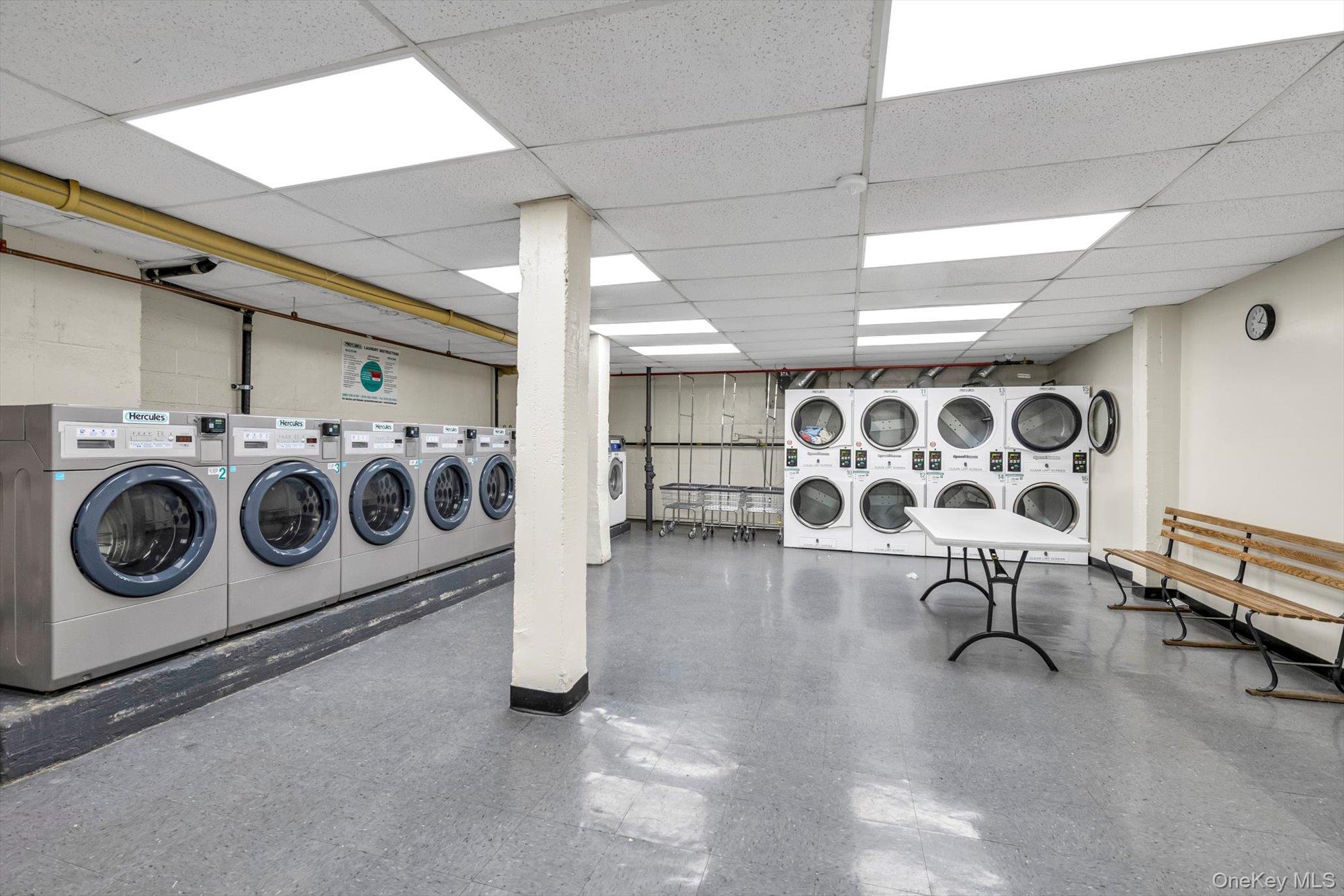42-25 80th Street, Unit 3D Queens, NY 11373 - Photo 14 of 17 Shared laundry featuring washer and dryer and stacked washing machine and dryer