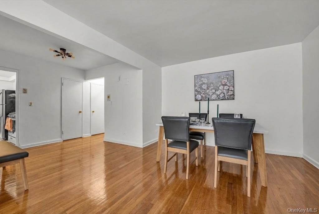 42-25 80th Street, Unit 3D Queens, NY 11373 - Photo 6 of 17 Dining space featuring light wood finished floors and baseboards