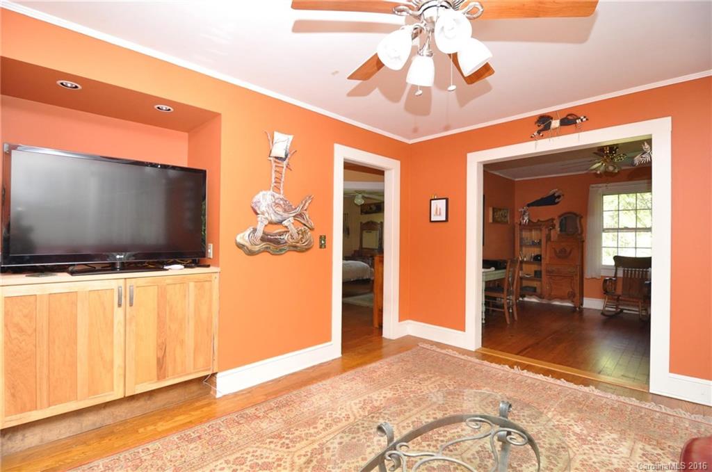 260 W Road Campobello, SC 29322 - Photo 11 of 23 a view of a livingroom with wooden floor and a ceiling fan