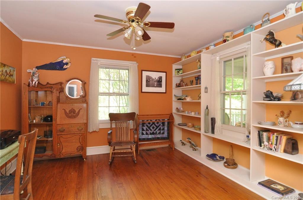 260 W Road Campobello, SC 29322 - Photo 12 of 23 a view of a livingroom with furniture a ceiling fan and wooden floor