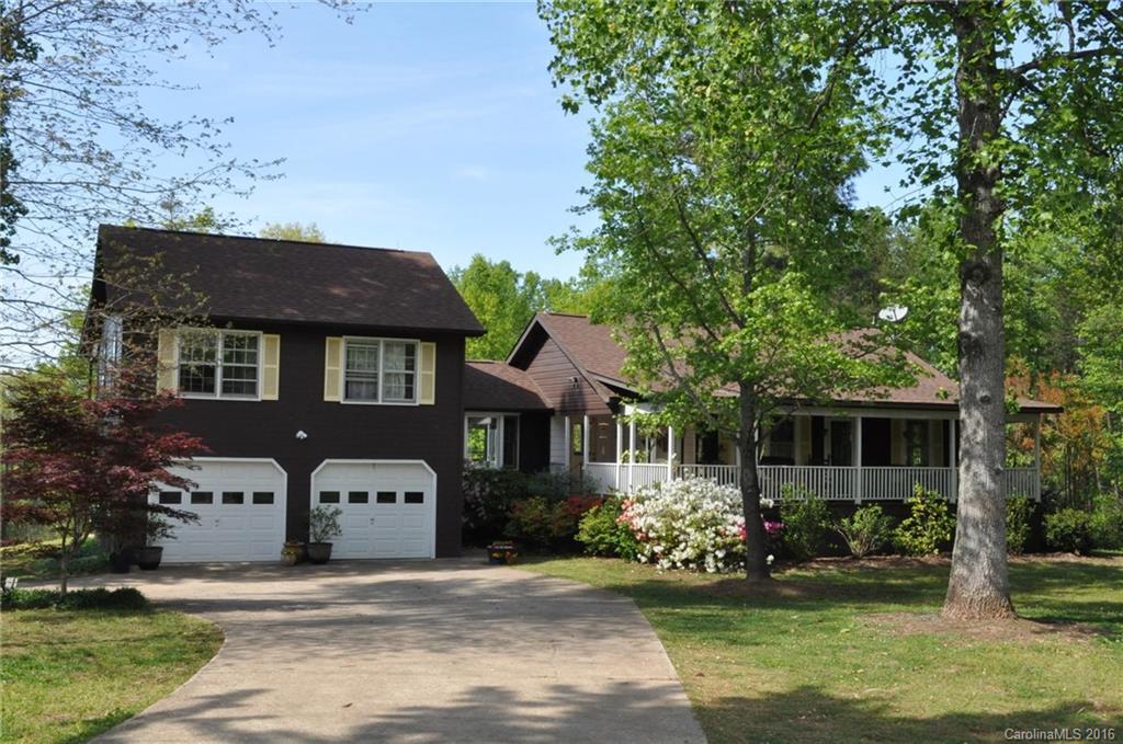 260 W Road Campobello, SC 29322 - Photo 5 of 23 a front view of a house with a garden