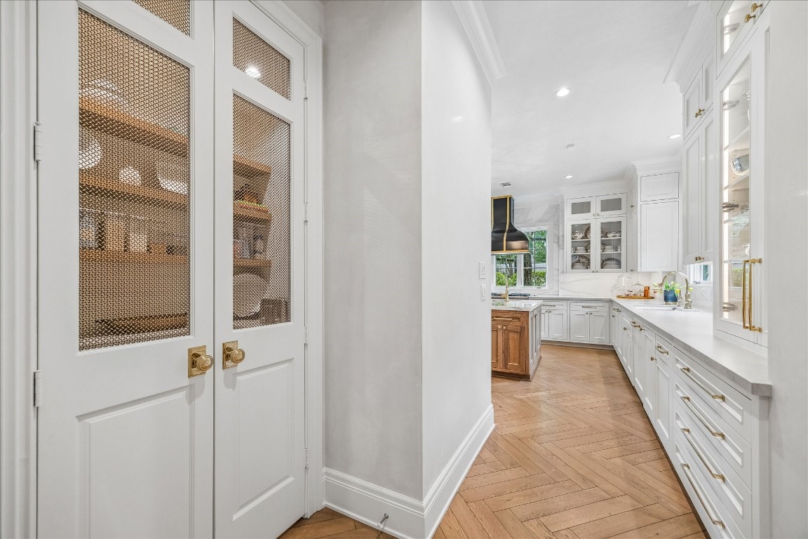 620 Hedwig Road Hunters Creek Village, TX 77024 - Photo 16 of 47 Now, this is a pantry! Custom doors set the stage as you enter the kitchen