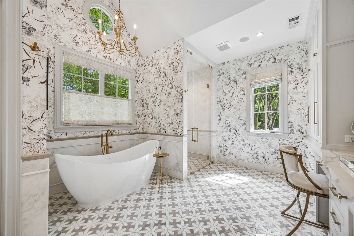 620 Hedwig Road Hunters Creek Village, TX 77024 - Photo 19 of 47 Spa-inspired primary bath with dual vanities, custom cabinetry, and refined finishes throughout.