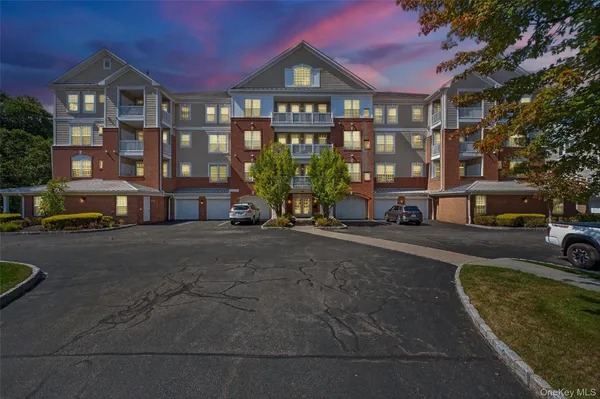 a city street lined with buildings and cars parked