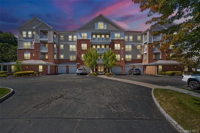 a city street lined with buildings and cars parked