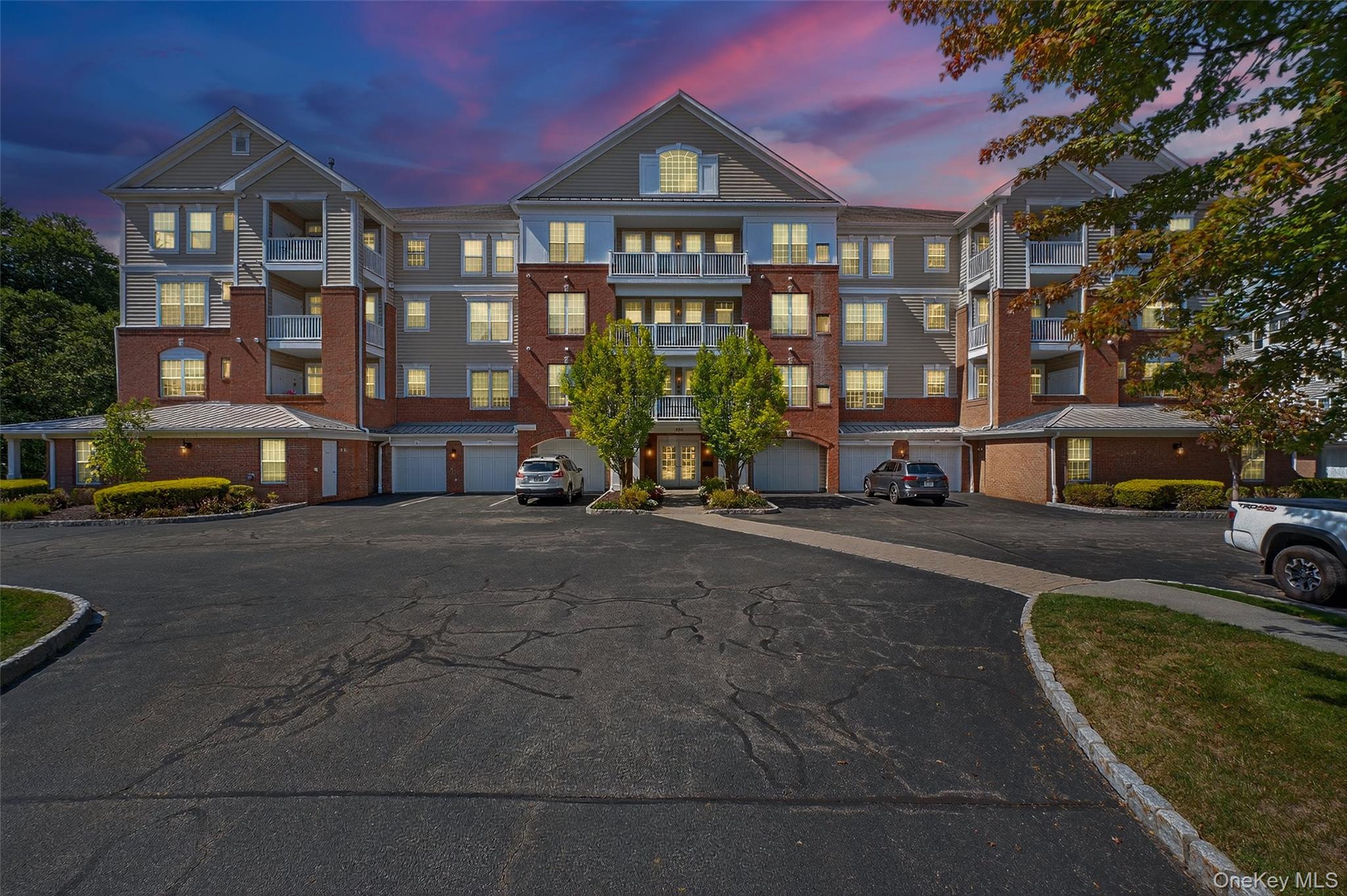 a city street lined with buildings and cars parked