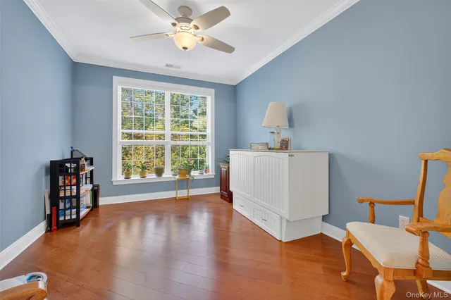 a workspace with furniture hardwood and a window