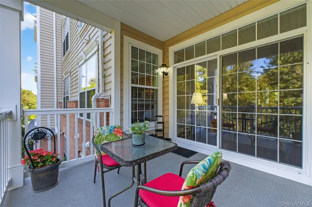 a view of a dining room with furniture and window