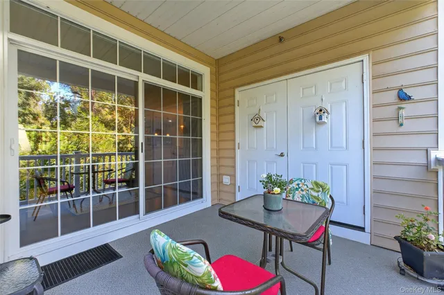 a view of a house with a potted plant and a glass door