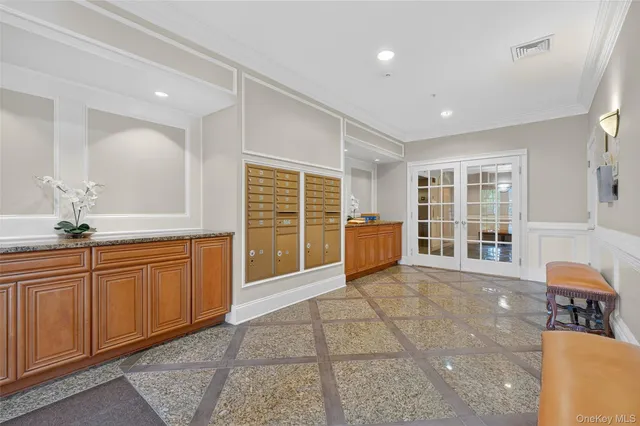 a view of a kitchen with granite countertop cabinets