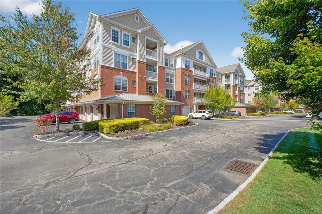 a view of a street with cars parked