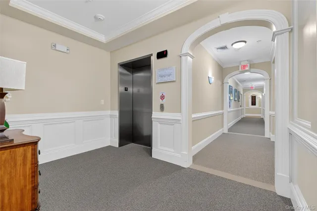 a view of a hallway view with staircase