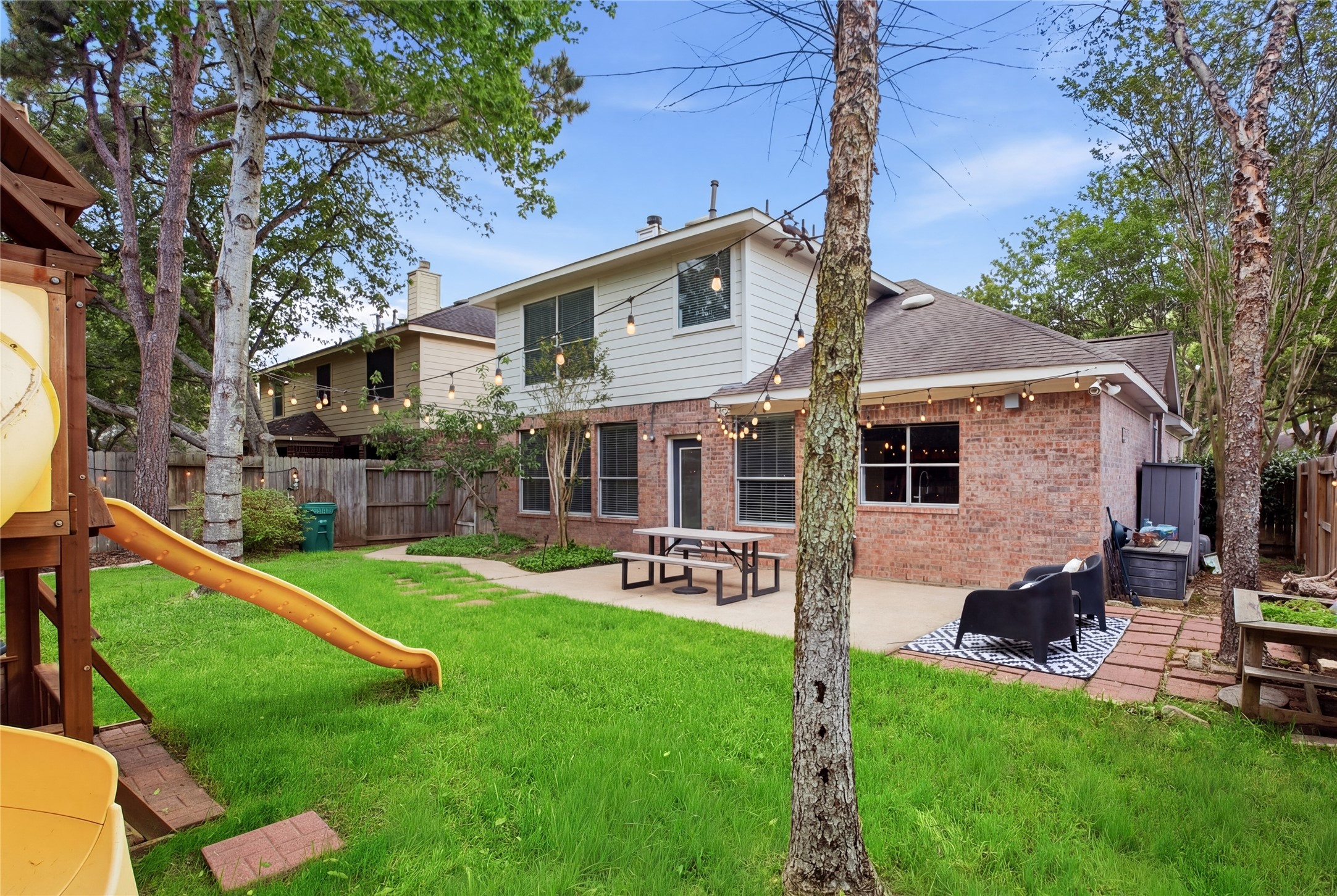 20907 Nettlebrook Lane Katy, TX 77450 - Photo 38 of 46 The extended patio is ready for everything from quiet evenings to weekend get-togethers, while the playscape adds major fun for the little ones.