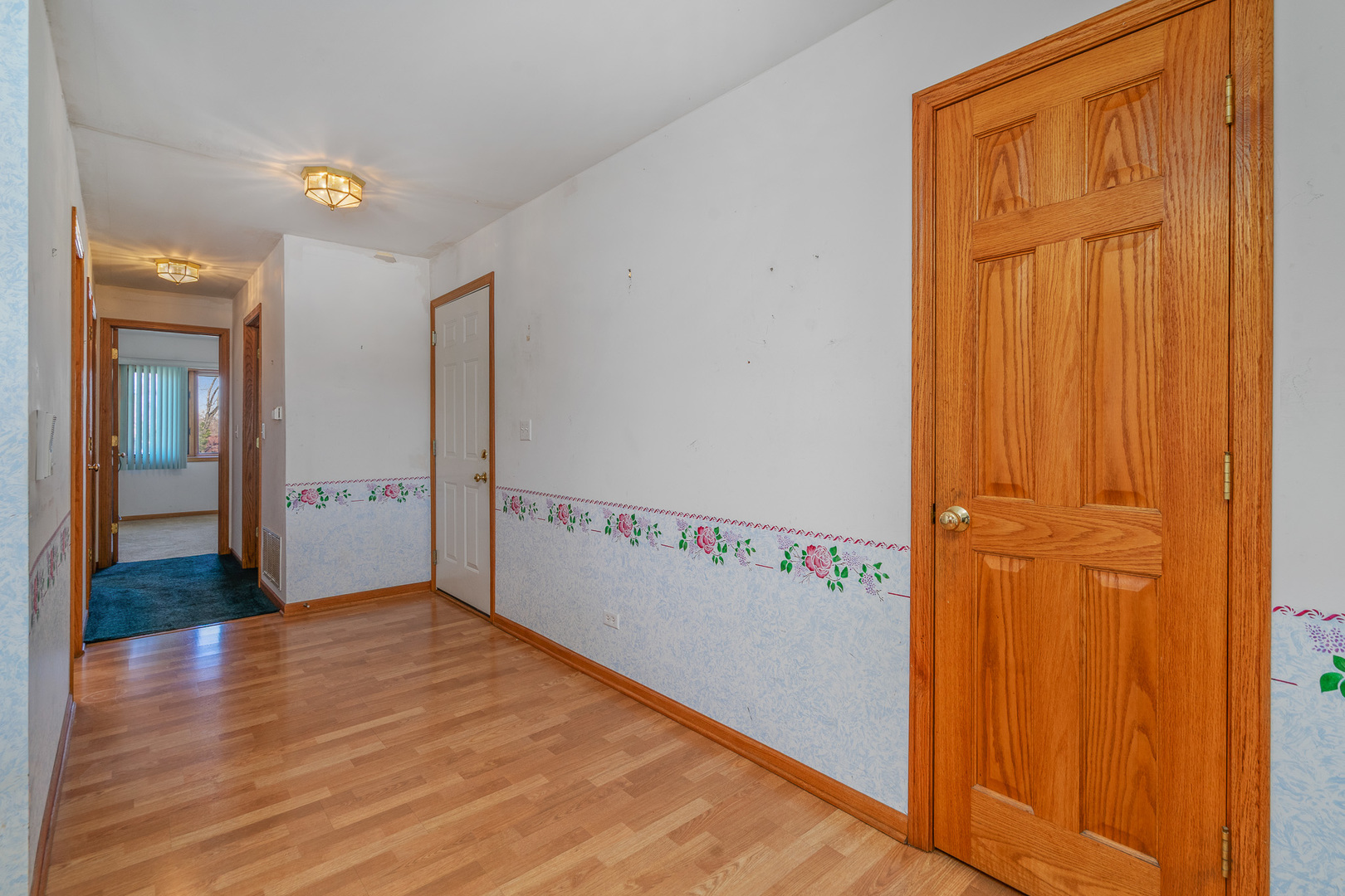 5242 West 79th Street, Unit 3D Burbank, IL 60459 - Photo 8 of 26 a view of a hallway with wooden floor