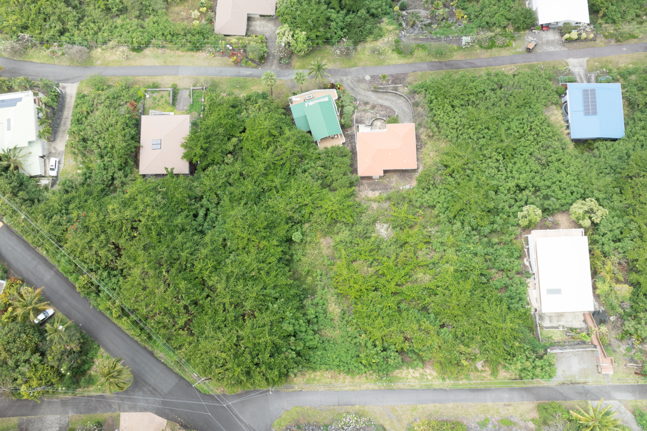 151 Rd East Captain Cook, HI 96704 - Photo 2 of 7 an aerial view of a house with a yard and lake view