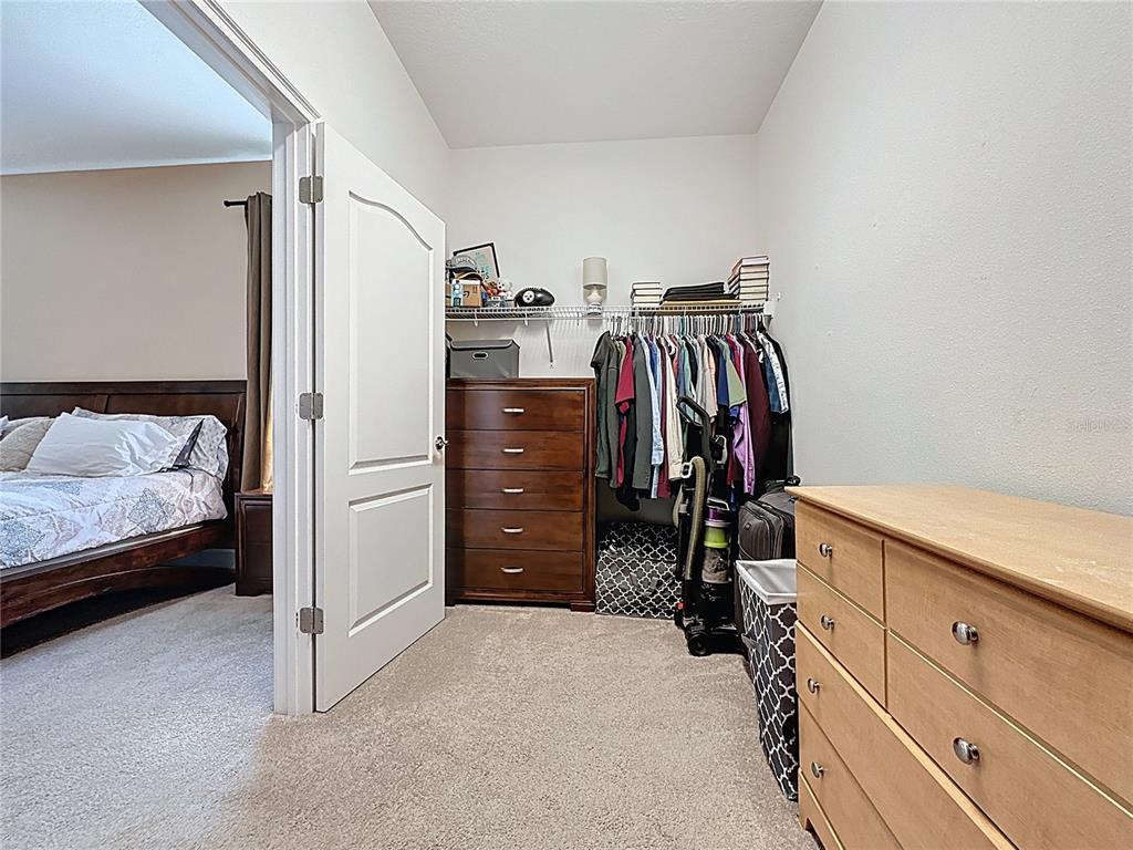 3193 Crispin Circle Harmony, FL 34773 - Photo 33 of 64 a view of a bedroom with closet and cabinet