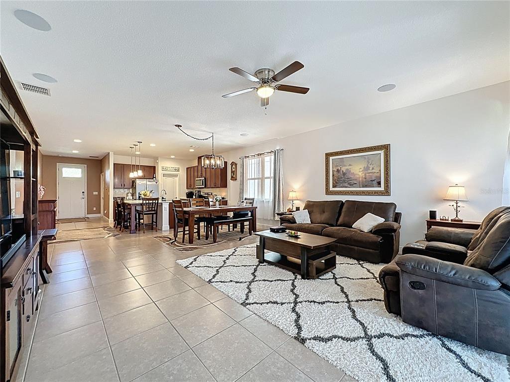 3193 Crispin Circle Harmony, FL 34773 - Photo 39 of 64 a living room with furniture and kitchen view
