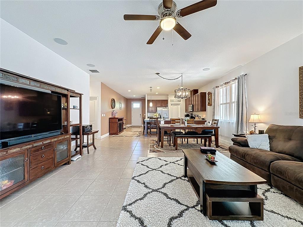 3193 Crispin Circle Harmony, FL 34773 - Photo 40 of 64 a living room with furniture and a flat screen tv