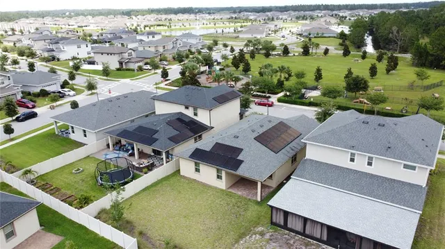 an aerial view of a house with a swimming pool