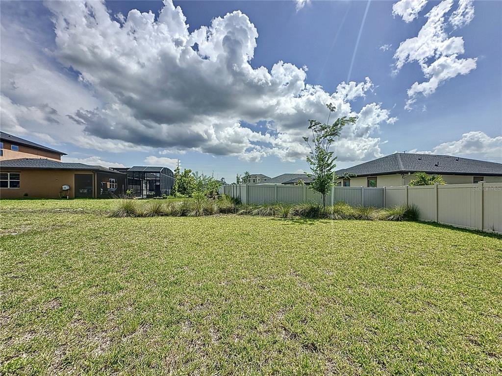 3193 Crispin Circle Harmony, FL 34773 - Photo 48 of 64 a bathroom with a sink mirror and vanity