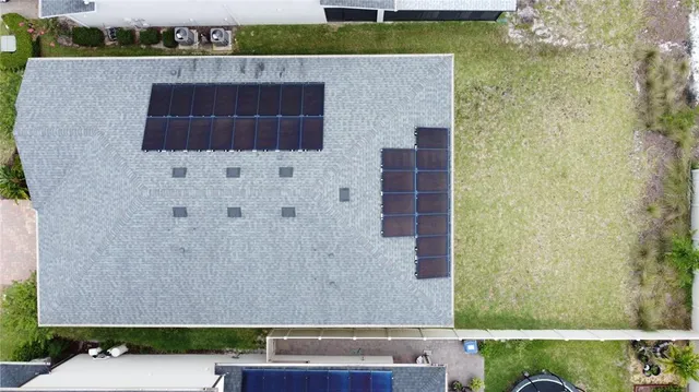 an aerial view of a house with a garden
