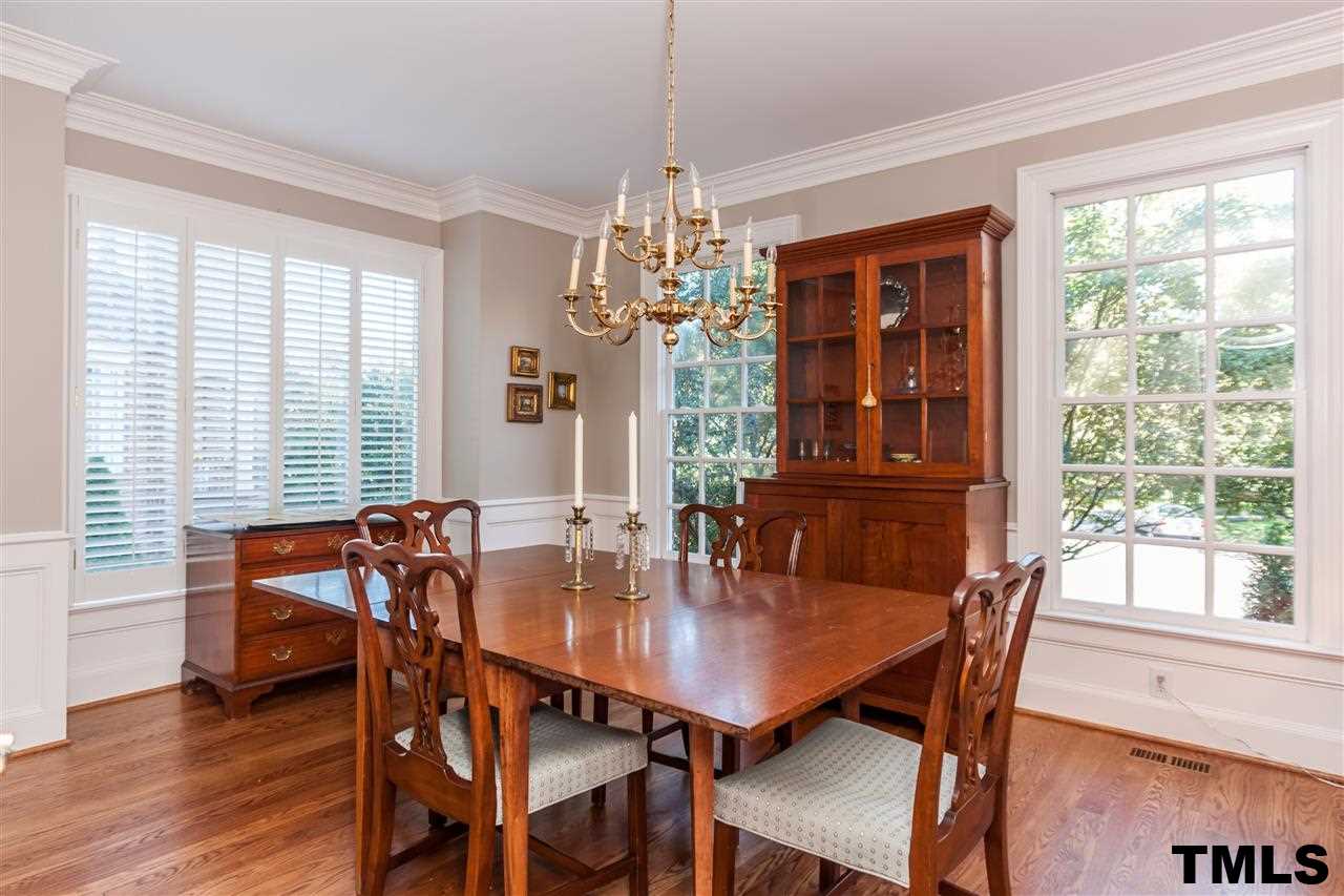 3201 Millstream Place Raleigh, NC 27609 - Photo 3 of 16 a view of a dining room with furniture window and wooden floor