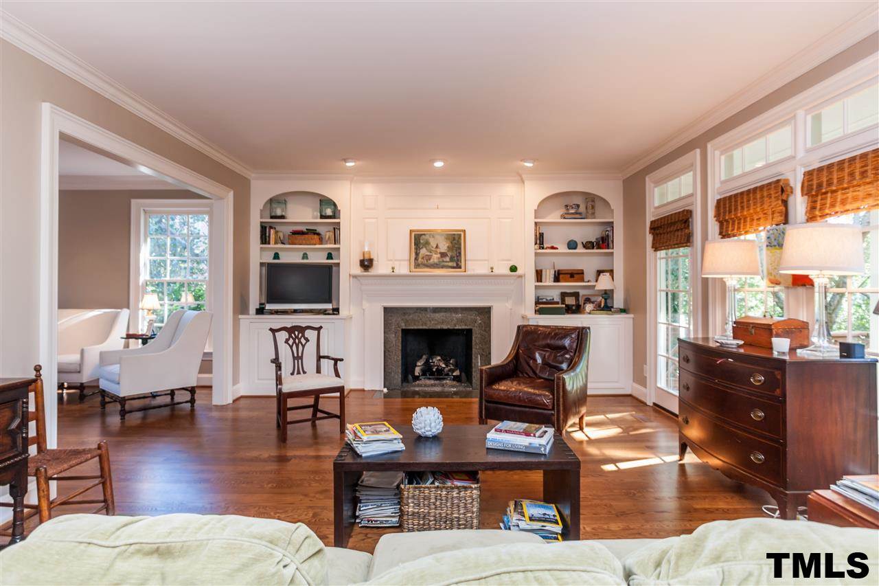 3201 Millstream Place Raleigh, NC 27609 - Photo 7 of 16 a living room with furniture large window and wooden floor