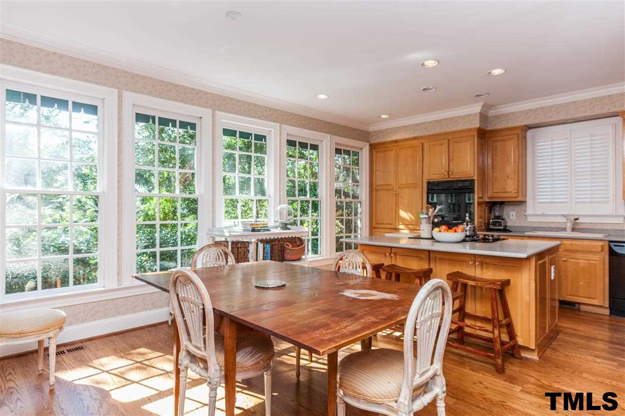 3201 Millstream Place Raleigh, NC 27609 - Photo 9 of 16 a view of a dining room with furniture window and wooden floor