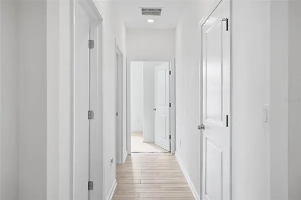 a view of a bathroom from the hallway