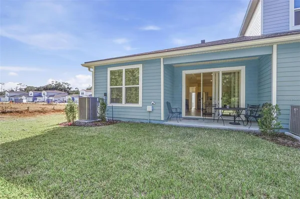 a front view of a house with a garden and porch