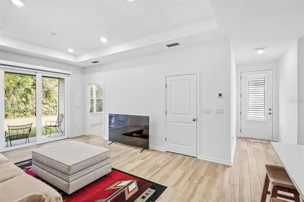 a living room with furniture rug and window