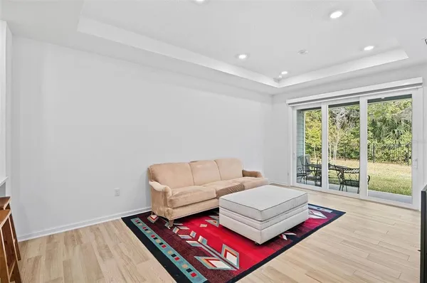 a living room with furniture and a rug