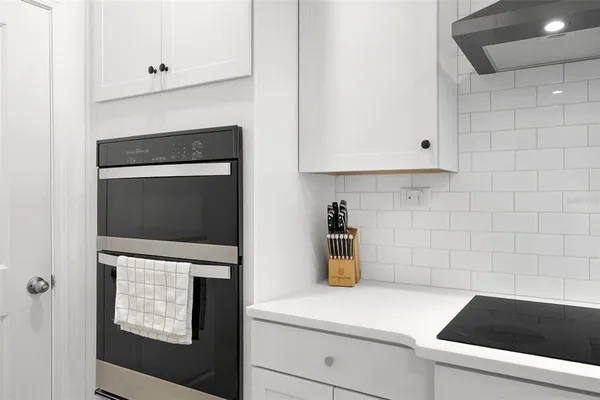 a kitchen with a microwave and a stove