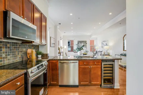 a kitchen with a sink stove and microwave