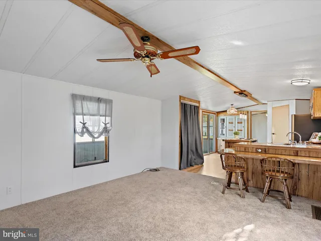 a view of a livingroom with furniture and window