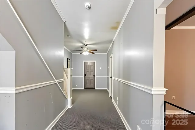 a view of a hallway with white walls