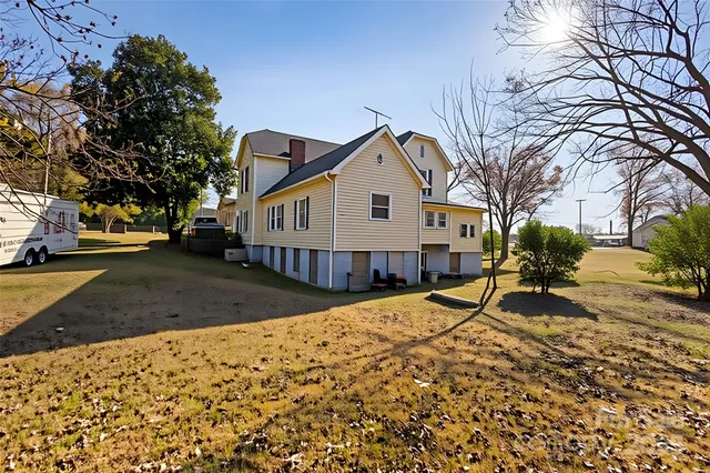 a view of a house with snow on the road