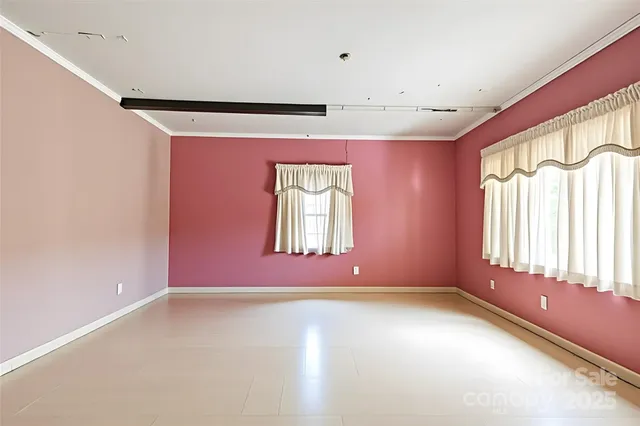 an empty room with windows